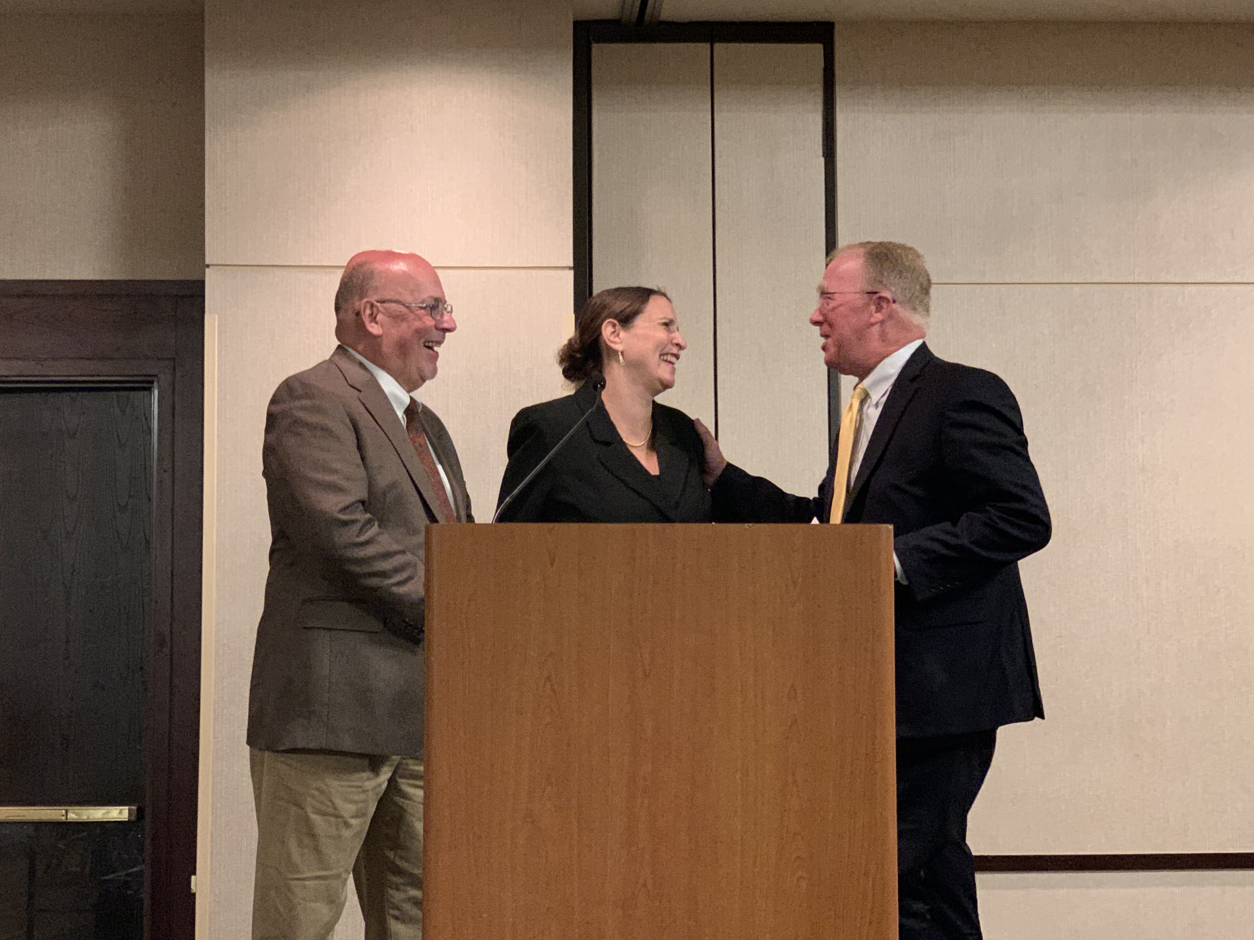 Awardee receives award from prize jury chair and shakes hands with the donor