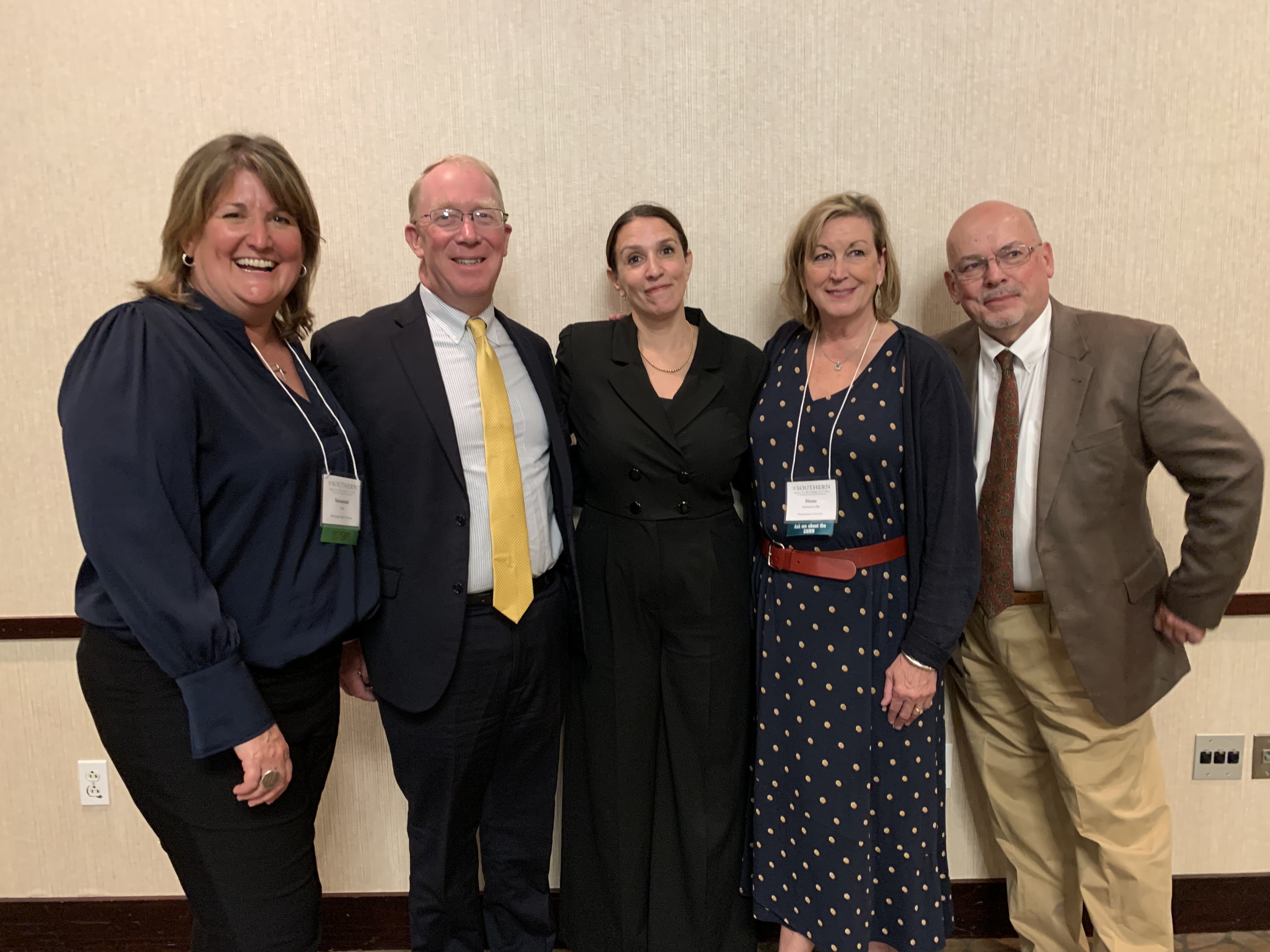 Awardee poses with four members of the prize selection jury